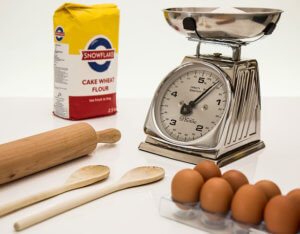 Weighing scales while cooking with children 300x234